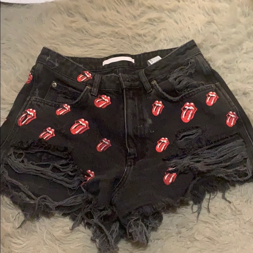 Rolling Stones distressed high waisted shorts.